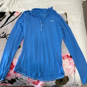 Blue Nike quarter zip athletic top